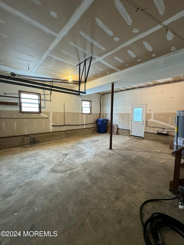 basement featuring electric water heater