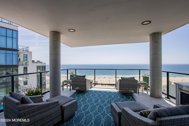 balcony with a view of the beach and a water view