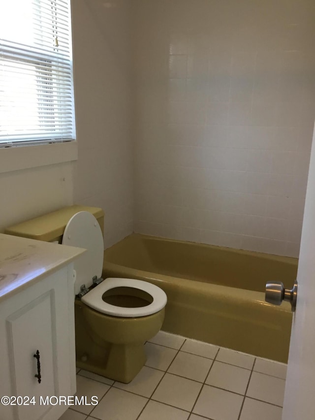 bathroom featuring tile patterned floors, vanity, and toilet