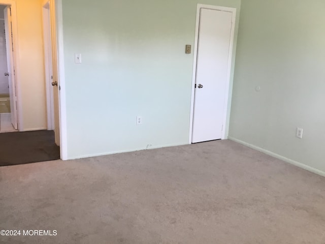 empty room featuring light colored carpet