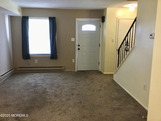 foyer entrance with carpet floors and a baseboard radiator