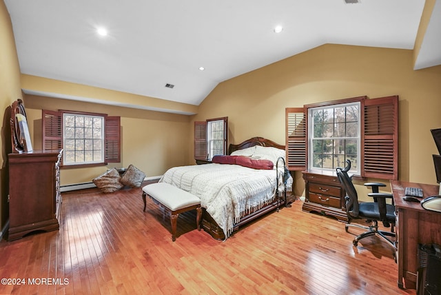 bedroom with hardwood / wood-style flooring, a baseboard radiator, and vaulted ceiling