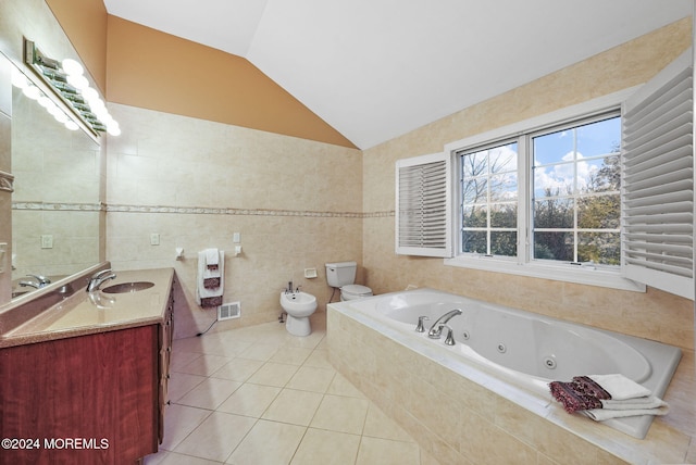 bathroom with vanity, lofted ceiling, a bidet, tile patterned flooring, and tile walls