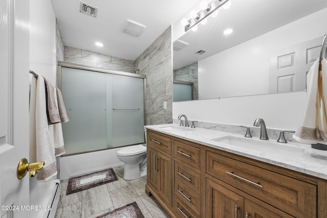 full bathroom with vanity, toilet, and bath / shower combo with glass door