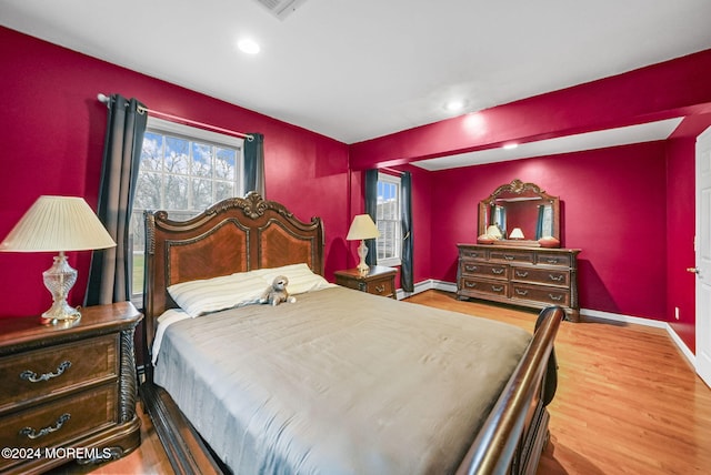 bedroom with wood-type flooring