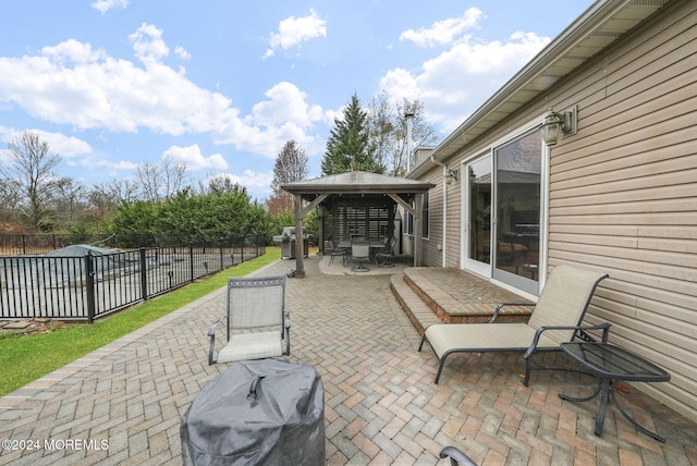 view of patio with a gazebo and a grill