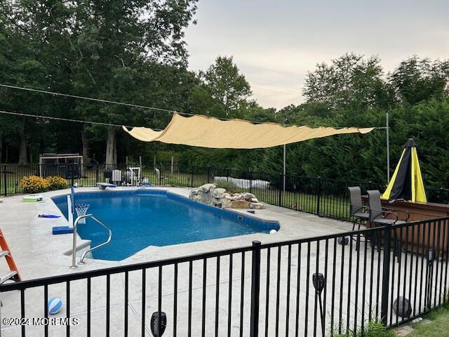 view of pool with a patio area