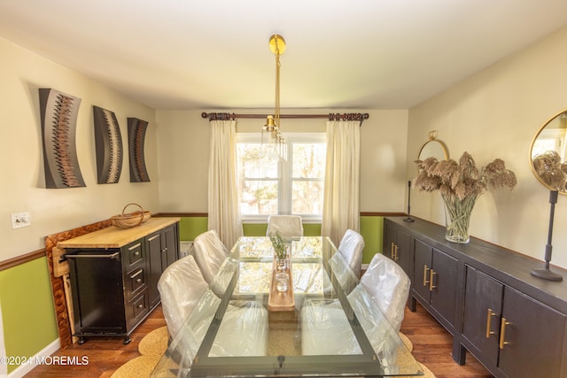 dining area featuring dark hardwood / wood-style floors