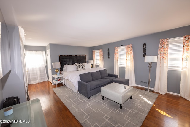 bedroom featuring dark hardwood / wood-style flooring