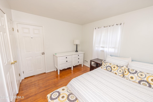 bedroom with hardwood / wood-style flooring