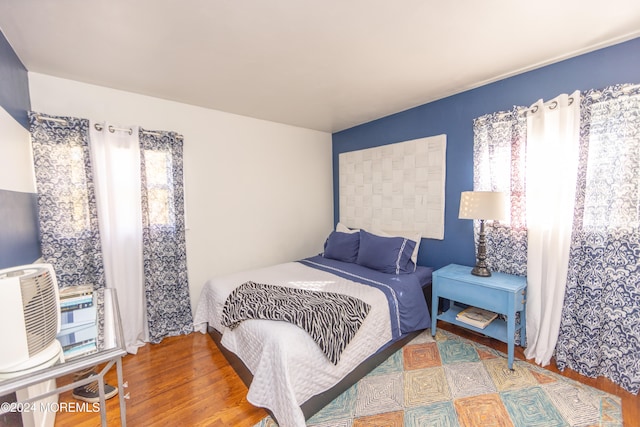 bedroom with wood-type flooring