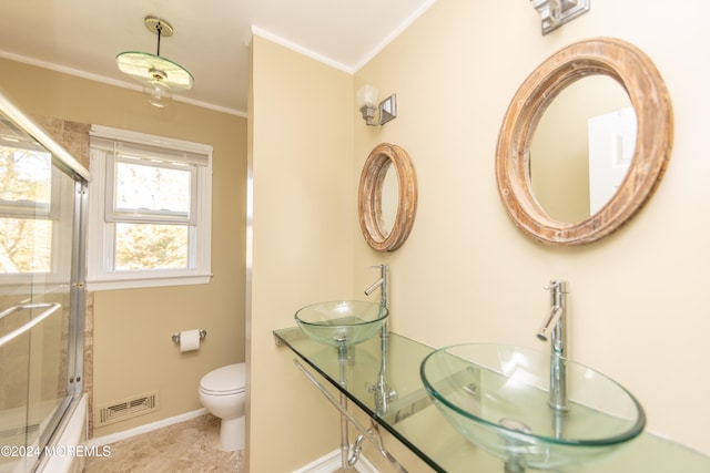 full bathroom with toilet, combined bath / shower with glass door, sink, and crown molding