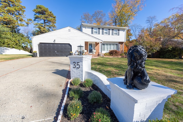 front facade featuring a garage and a front yard