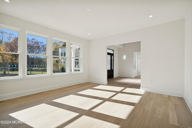 empty room with light hardwood / wood-style flooring