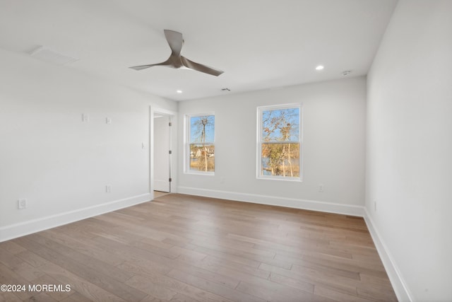 unfurnished room featuring light hardwood / wood-style flooring and ceiling fan