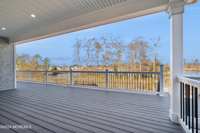 wooden terrace with a water view