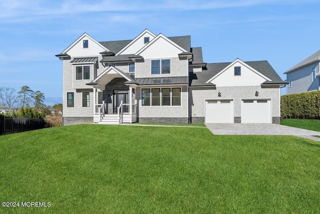 craftsman-style house with a front lawn