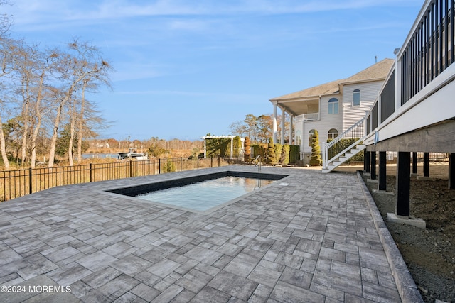 view of swimming pool featuring a patio