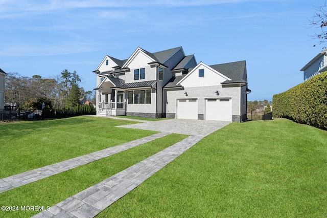 view of front of house featuring covered porch and a front lawn