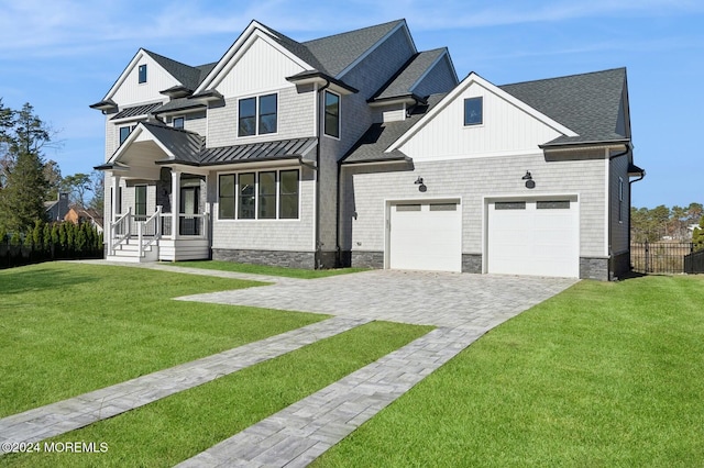 view of front of house with a garage and a front yard