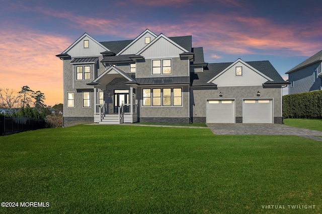 view of front facade featuring a yard and a garage