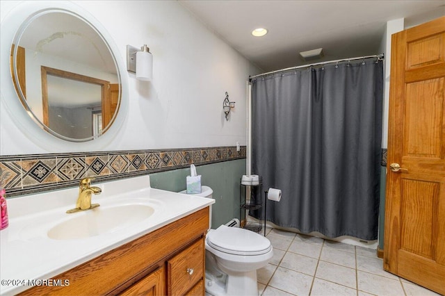 bathroom with vanity, walk in shower, tile patterned flooring, and toilet