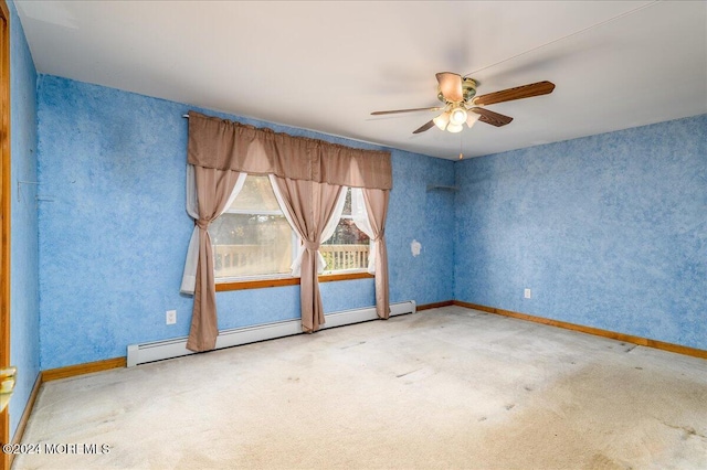 carpeted empty room featuring a baseboard radiator and ceiling fan