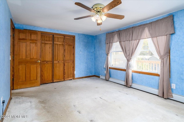 unfurnished bedroom featuring light carpet, ceiling fan, and a closet