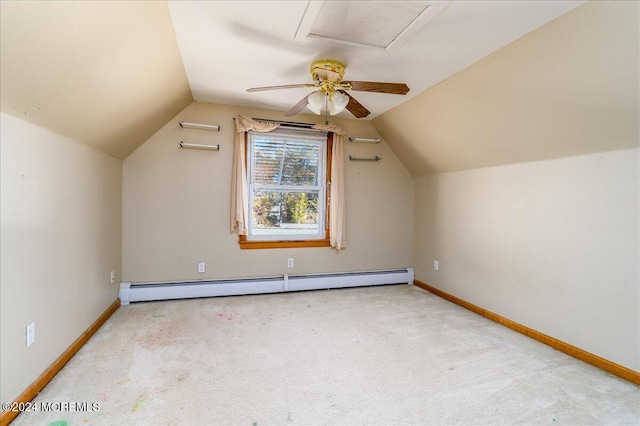 additional living space featuring light colored carpet, vaulted ceiling, and baseboard heating