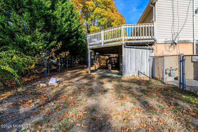 view of yard featuring a wooden deck