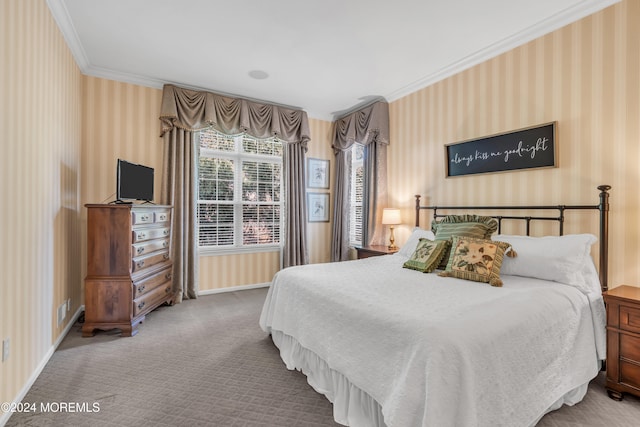 bedroom with ornamental molding and carpet