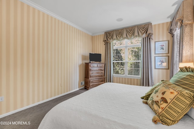 bedroom featuring ornamental molding and carpet flooring