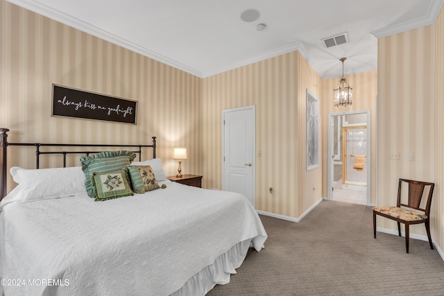 carpeted bedroom with ensuite bath, crown molding, and a notable chandelier