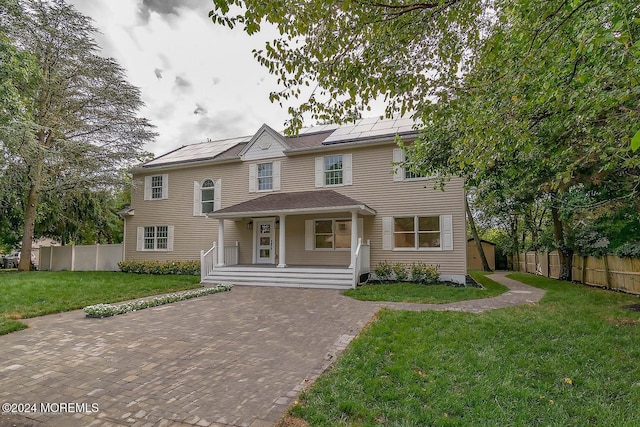 view of front of home featuring a front lawn and a porch