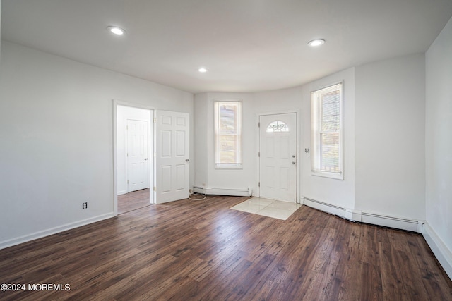 foyer with dark hardwood / wood-style flooring and a baseboard radiator