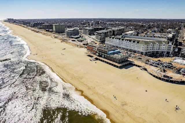 aerial view with a view of the beach and a water view