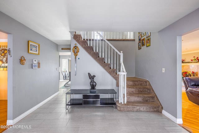 stairway with hardwood / wood-style flooring