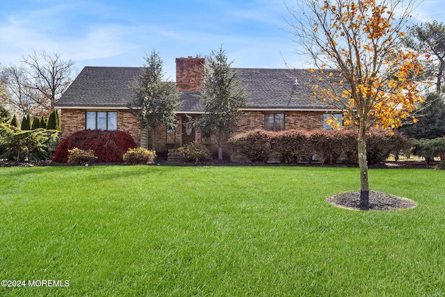 ranch-style home featuring a front yard