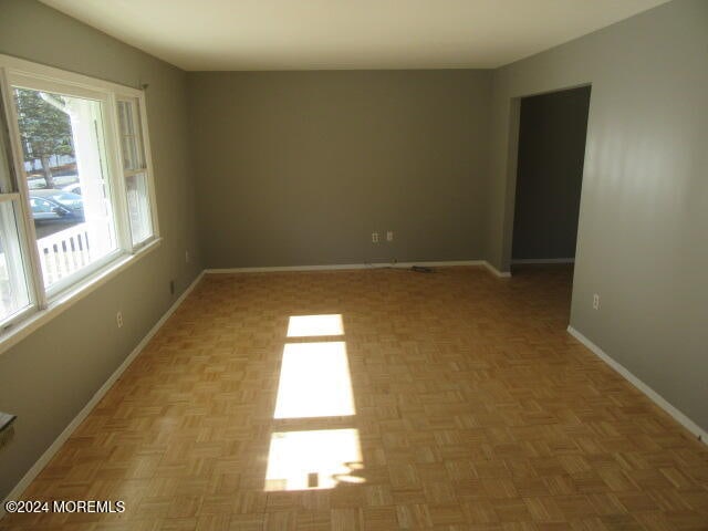 spare room featuring light parquet flooring