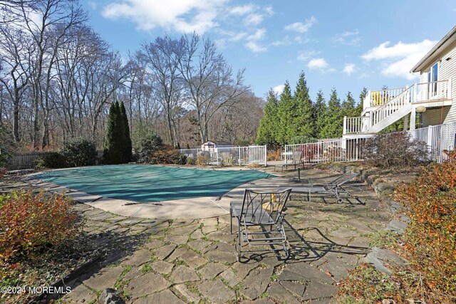 view of pool featuring a patio area