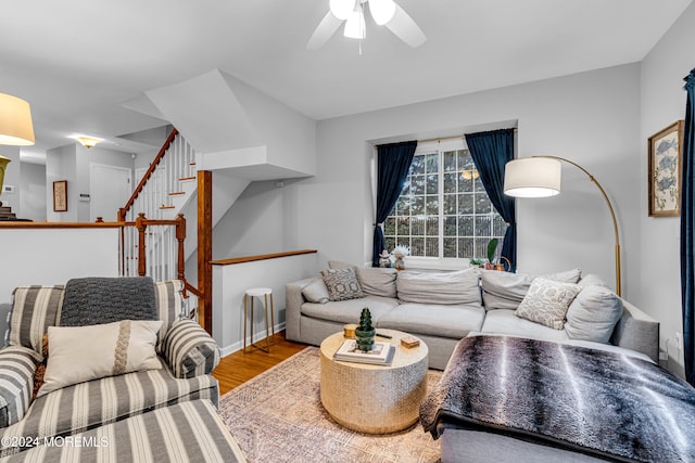 living room with ceiling fan and wood-type flooring