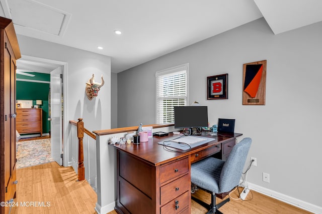 office with light hardwood / wood-style flooring