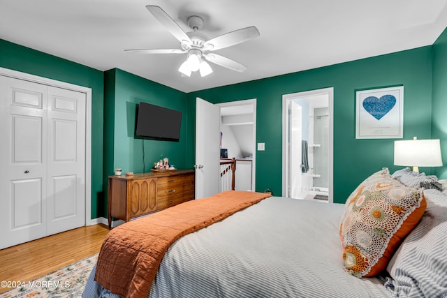 bedroom with connected bathroom, hardwood / wood-style flooring, and ceiling fan