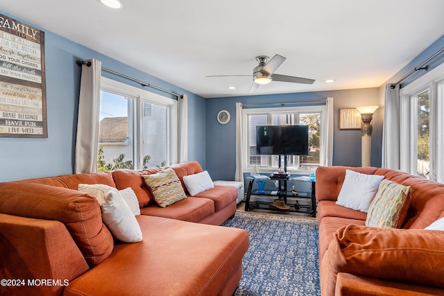 living room with ceiling fan and plenty of natural light