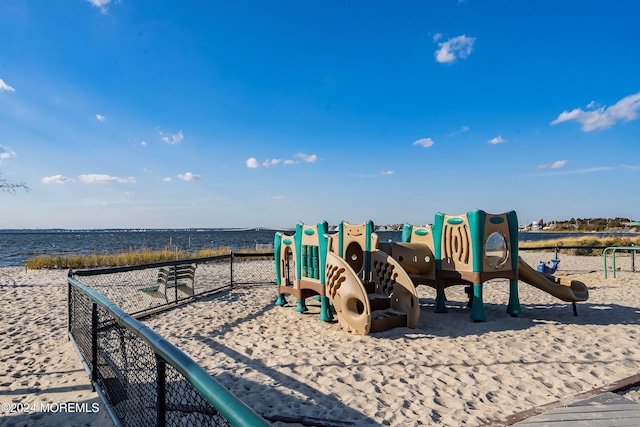 view of jungle gym with a water view