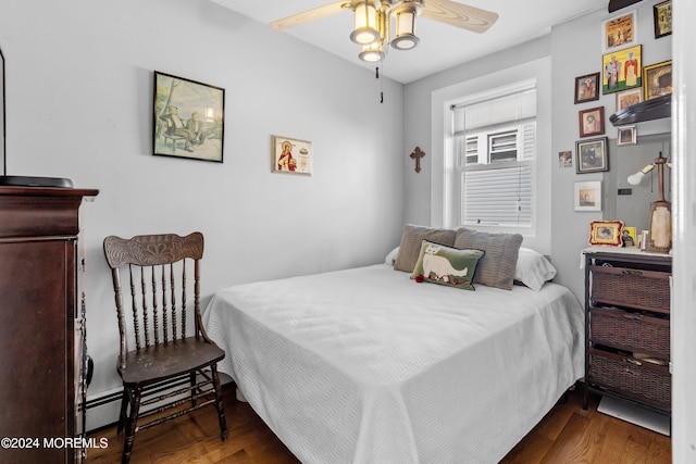 bedroom with dark wood-type flooring and ceiling fan