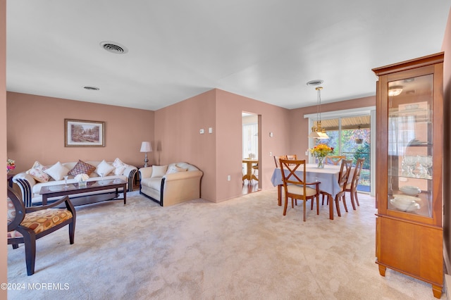 living room featuring light carpet