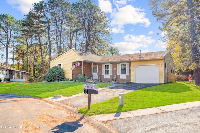 single story home with a front lawn and a garage