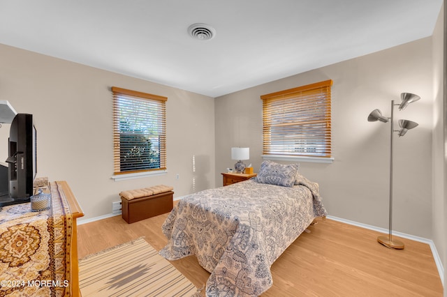 bedroom with light hardwood / wood-style floors