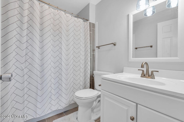 bathroom featuring hardwood / wood-style floors, vanity, and toilet